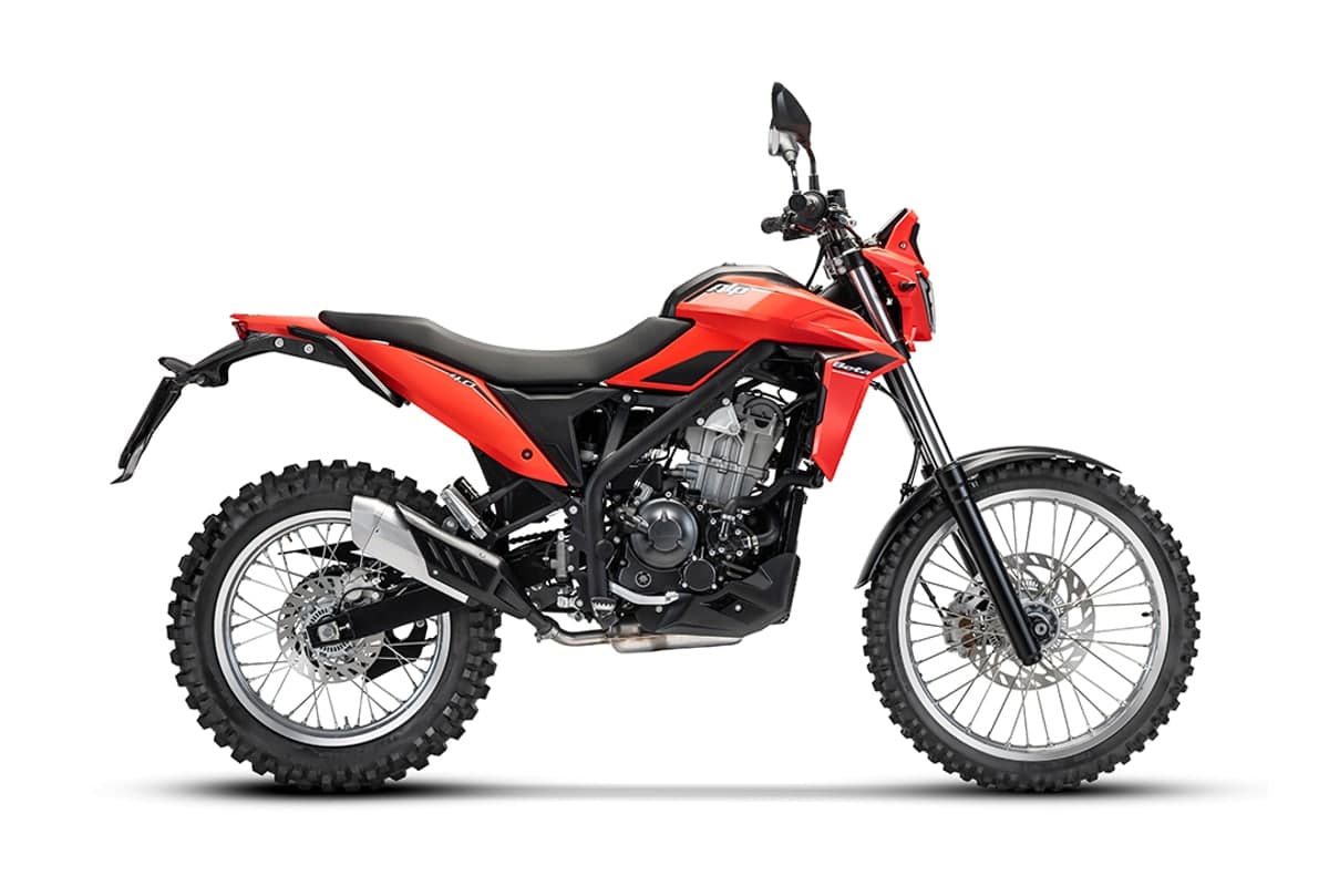 2026 Beta Alp 4.0 dual sport in red, right-side studio profile on white showing the 21-inch spoked front wheel, knobby tires and high front fender