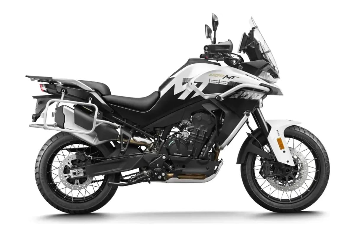 2026 CFMoto Ibex 800 E adventure motorcycle in white and blue swirl graphics, left-side studio profile showing gold spoked wheels and aluminum side cases