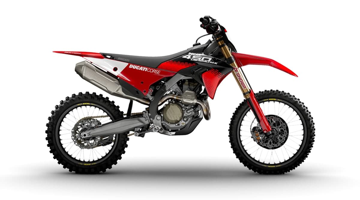 2026 Ducati Desmo450 MX Factory motocross bike in red and black, right-side studio profile showing gold Showa forks and Akrapovic exhaust
