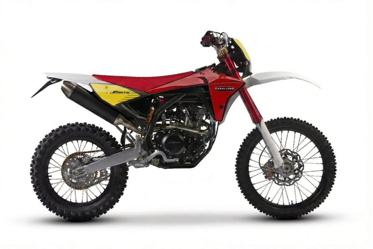 2027 Fantic TL250 Caballero in red, yellow and white, right-side studio profile on white showing the Fantic FRS fork, Arrow silencer and spoked wheels