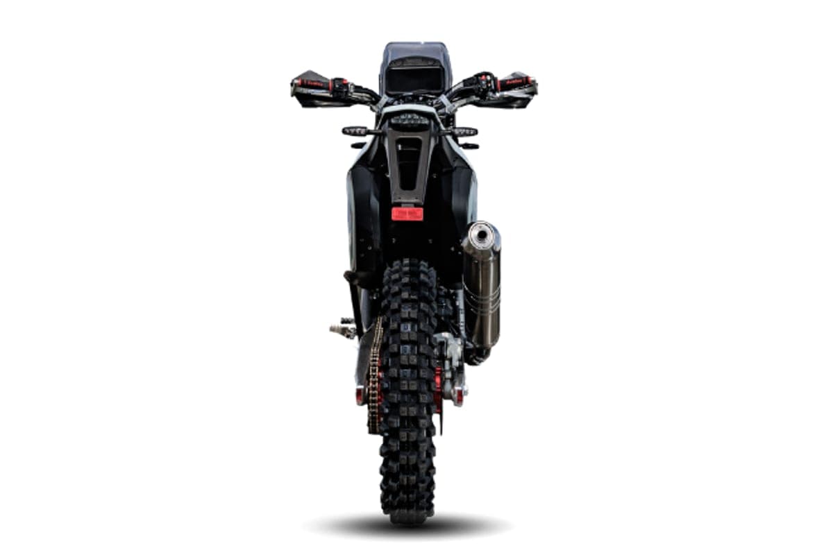 AJP PR7 rear-on studio view showing the tail section, chain drive, disc brake and stacked exhaust canister