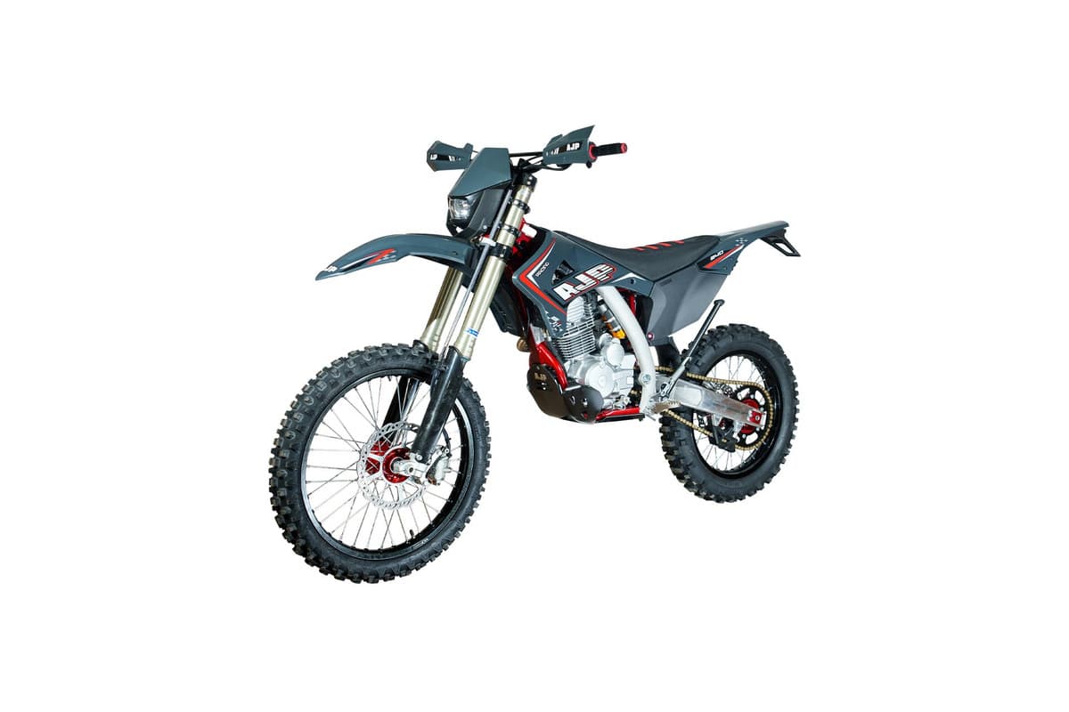 AJP SPR240X right-side studio profile showing the muffler, air-cooled cylinder and skid plate