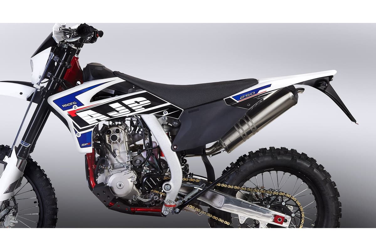 Close-up of the AJP SPR250's left side, showing the 249cc liquid-cooled engine, seat and aluminium swingarm