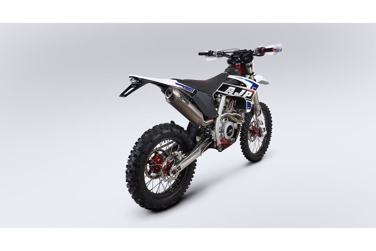 AJP SPR510R rear three-quarter studio view showing the GPR muffler, aluminium swingarm and 18-inch rear wheel