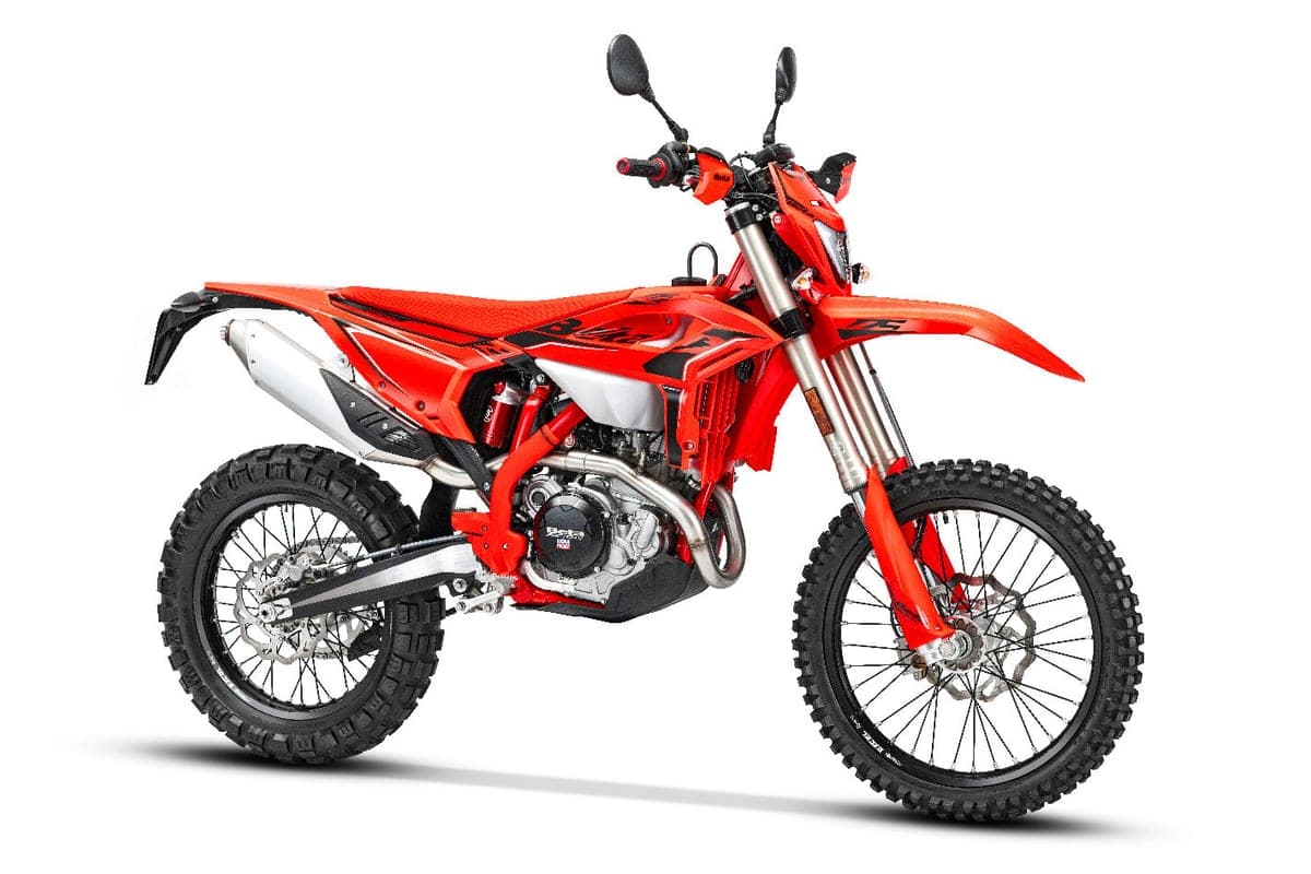 Beta 390 RS right-side studio view highlighting the silver exhaust canister, red frame and inverted forks