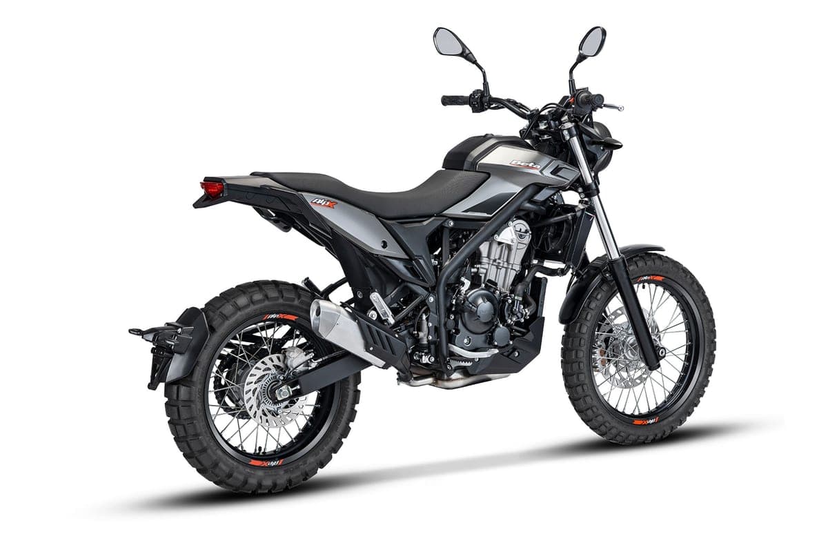 Beta Alp X rear three-quarter studio view in grey and black, highlighting the flat bench seat, rear disc brake and stubby upswept exhaust