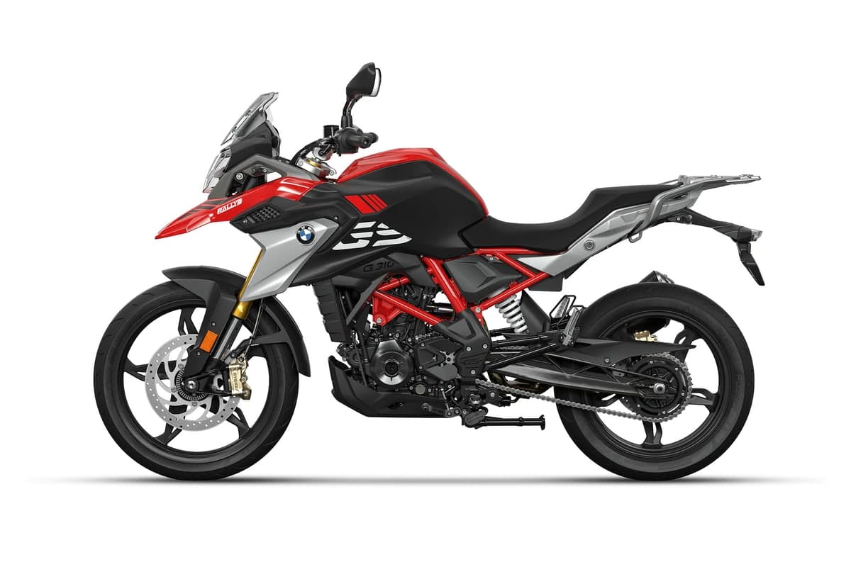 BMW G 310 GS left-side studio profile showing the chain, rear monoshock and upswept silencer