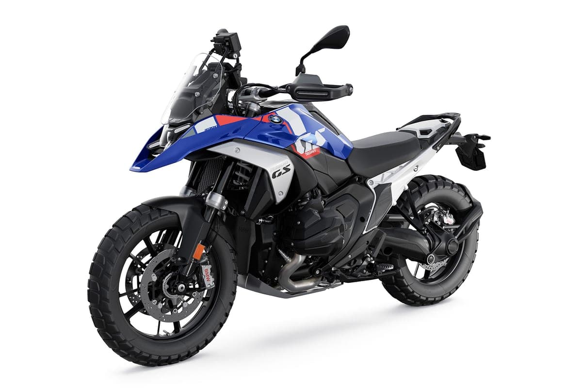 2027 BMW R 1300 GS in blue livery, front three-quarter studio view highlighting the tall windscreen, knuckle guards and knobby front tire