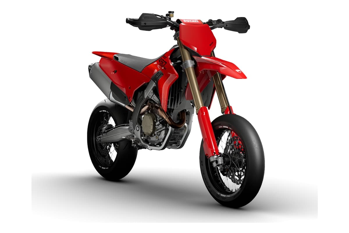 Ducati Desmo450 SM front three-quarter studio view showing the front number plate, handguards, Kashima-coated Showa fork and radial front brake caliper