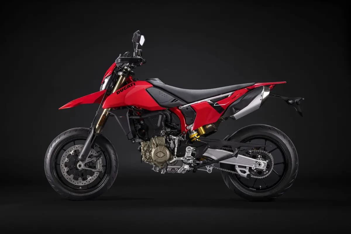 Ducati Hypermotard 698 Mono left-side studio profile highlighting the single-cylinder engine, gold rear shock and stubby underbelly exhaust