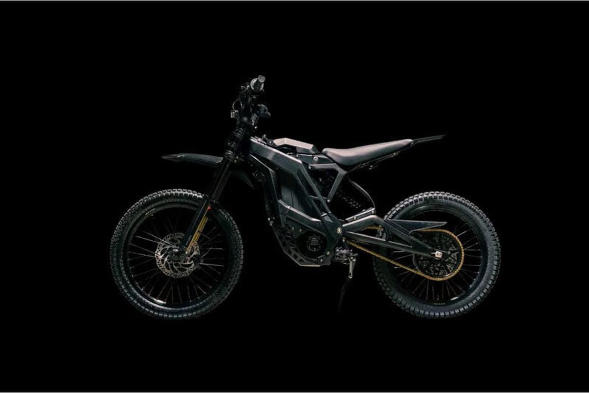 E-Ride Pro SS 3.0 lit against a dark background, showing the frame, battery pack and swingarm