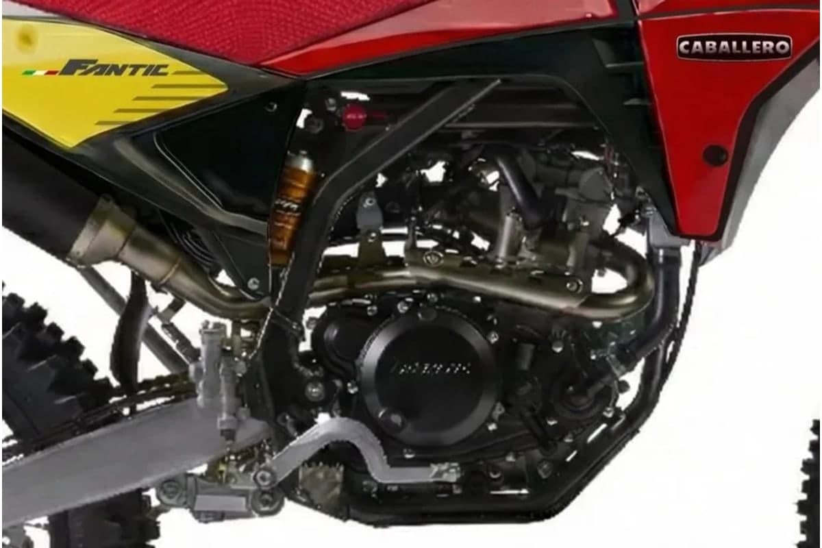 Engine and frame detail of the Fantic TL250 Caballero showing the CrMo perimeter frame, piggyback shock and exhaust header