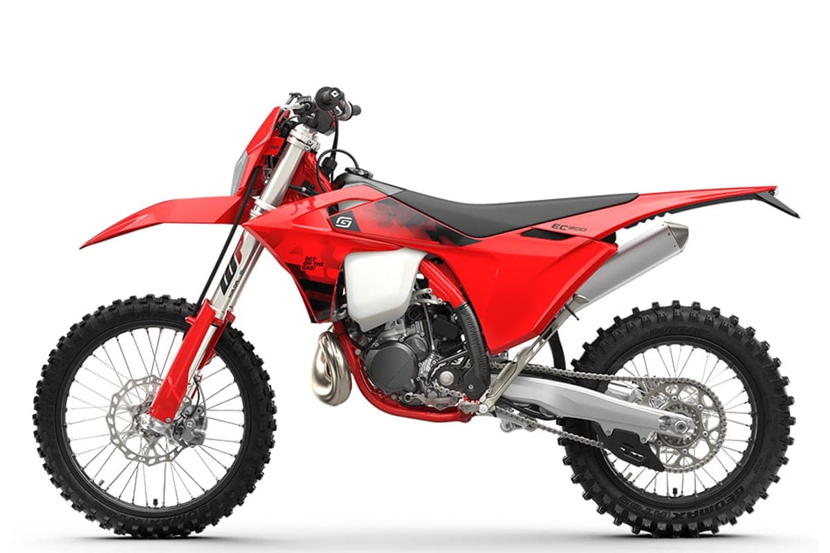 GasGas EC 300 right-side studio profile, red bodywork with black EC300 seat graphics, white radiator shroud accent and spoked wheels