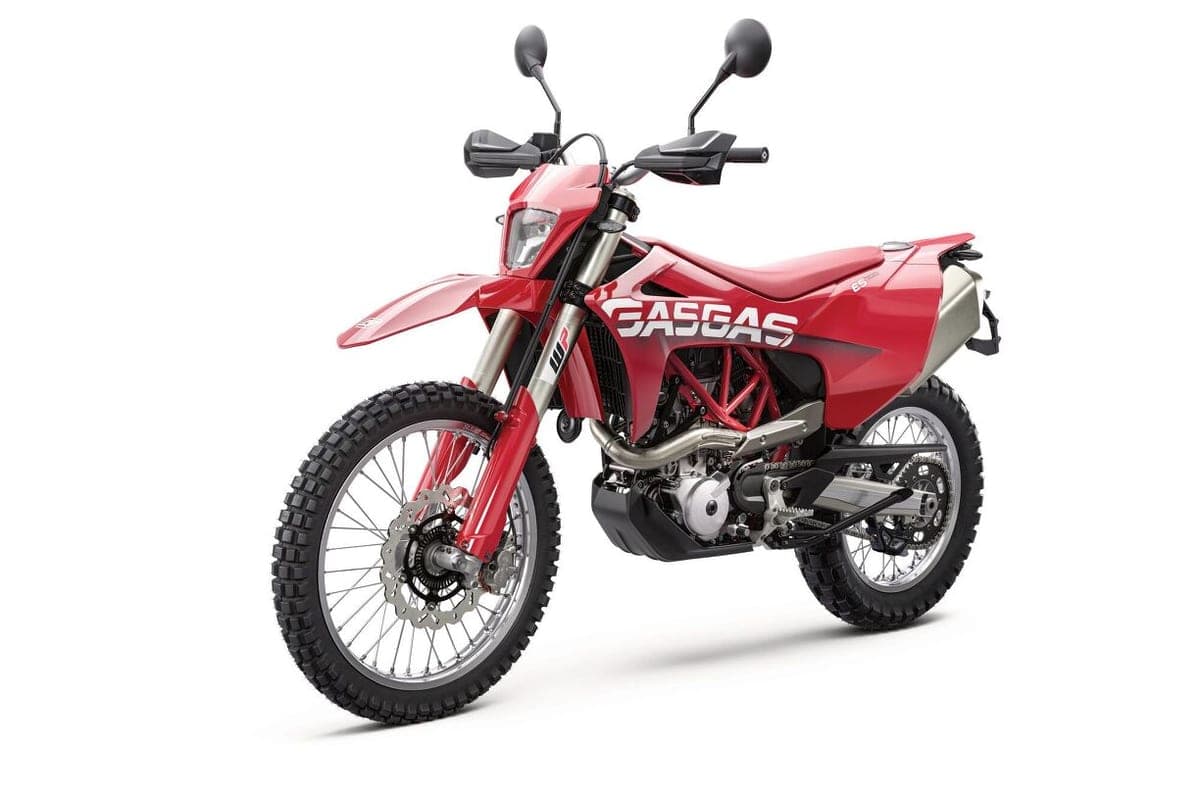 2024 GasGas ES 700 front three-quarter studio view highlighting the WP inverted fork, round headlight and trellis-style red frame