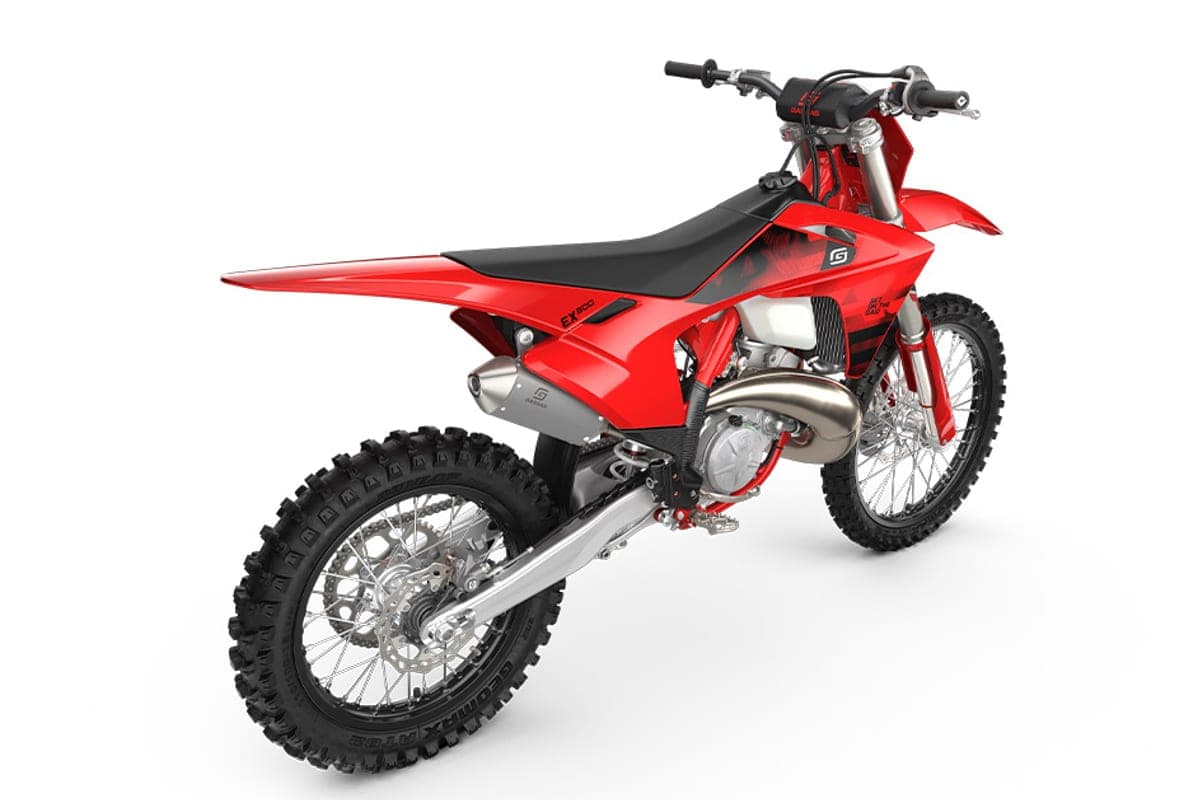 GasGas EX 300 rear three-quarter studio view highlighting the chrome expansion chamber, footpeg and rear disc brake assembly