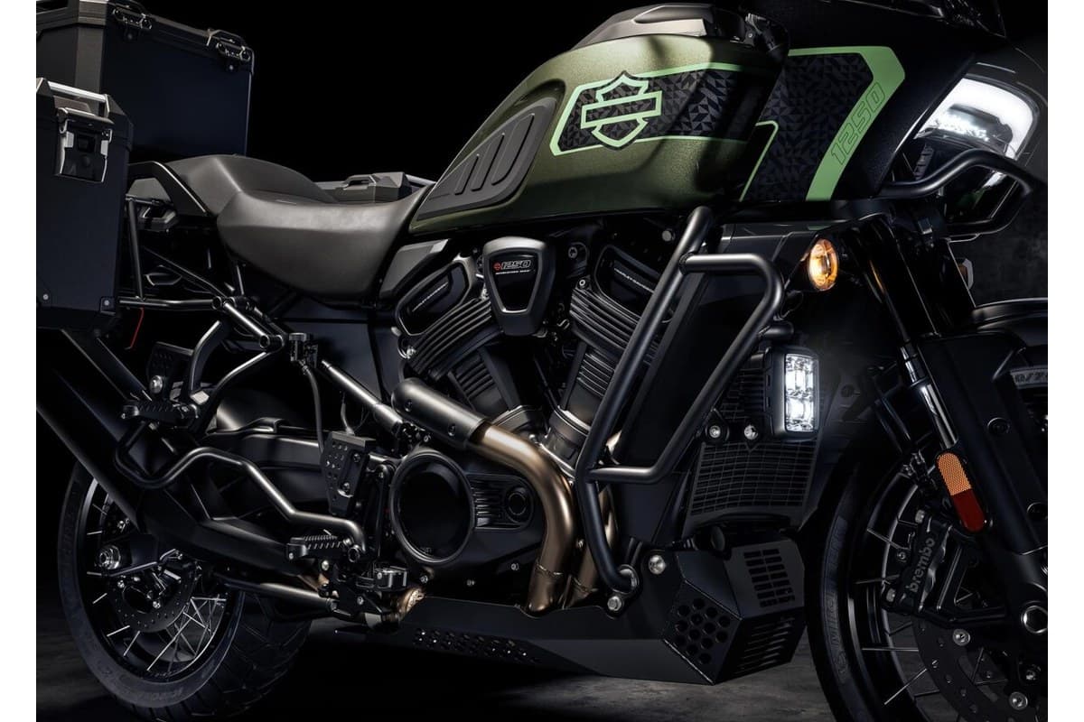 Pan America 1250 Limited detail shot of the V-twin engine, LED fog light and Brembo front brake caliper against a dark background