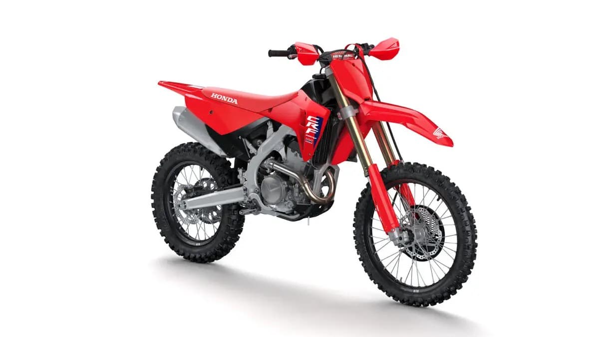 Honda CRF250RX front three-quarter studio view highlighting the CRF graphics panel, gold fork tubes and silver exhaust muffler