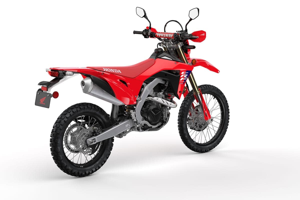 Honda CRF450RL rear three-quarter studio view with Renthal handlebars, twin mirrors and stacked taillight over the license plate bracket