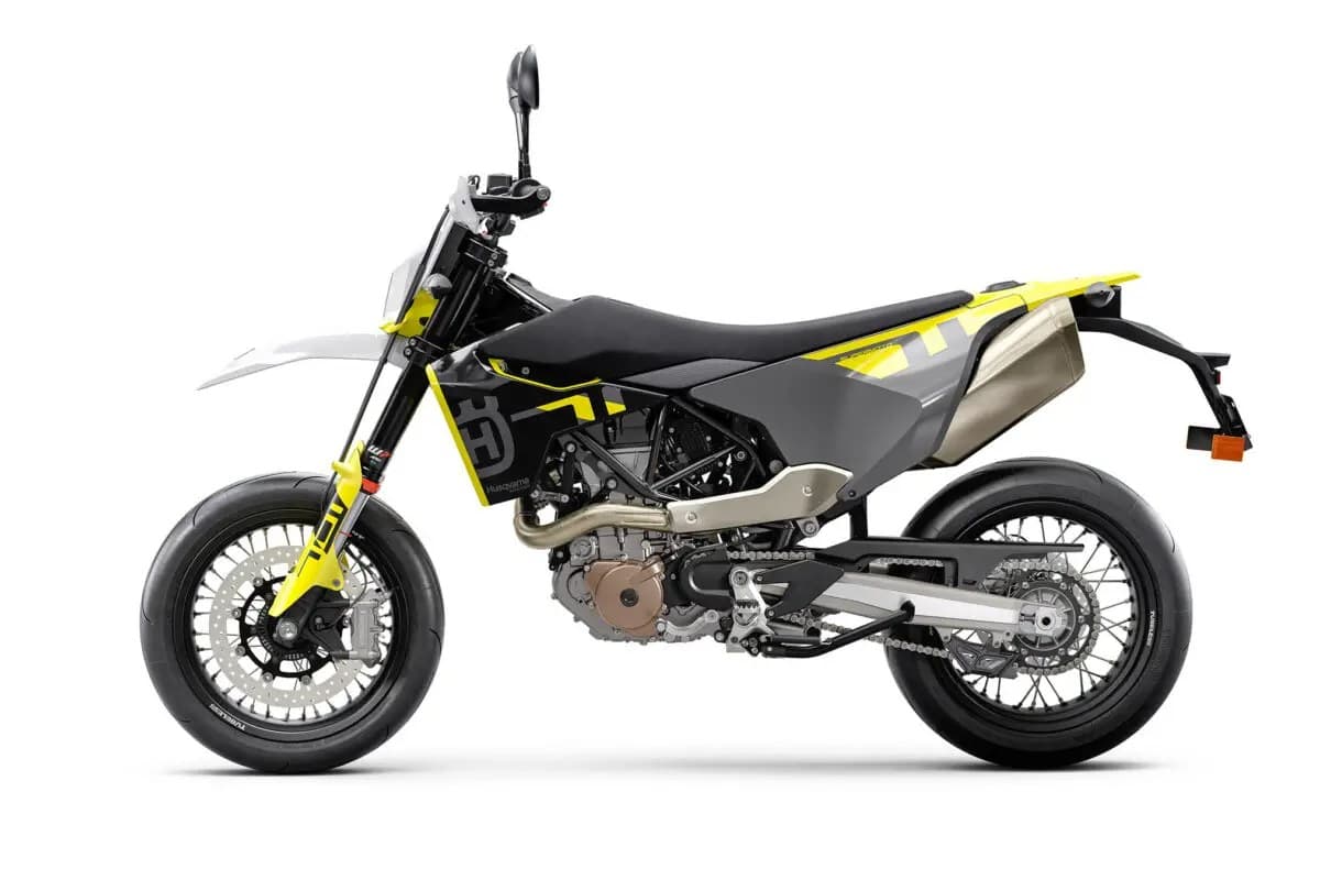 Husqvarna 701 Supermoto left-side studio profile highlighting the titanium-look muffler, single-cylinder engine and inverted forks