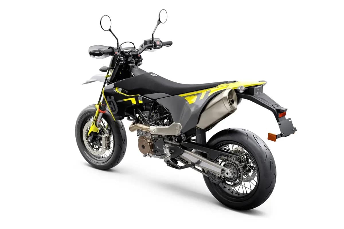 Husqvarna 701 Supermoto rear three-quarter studio view showing the stubby tail, stainless exhaust tip and wide supermoto rear tire