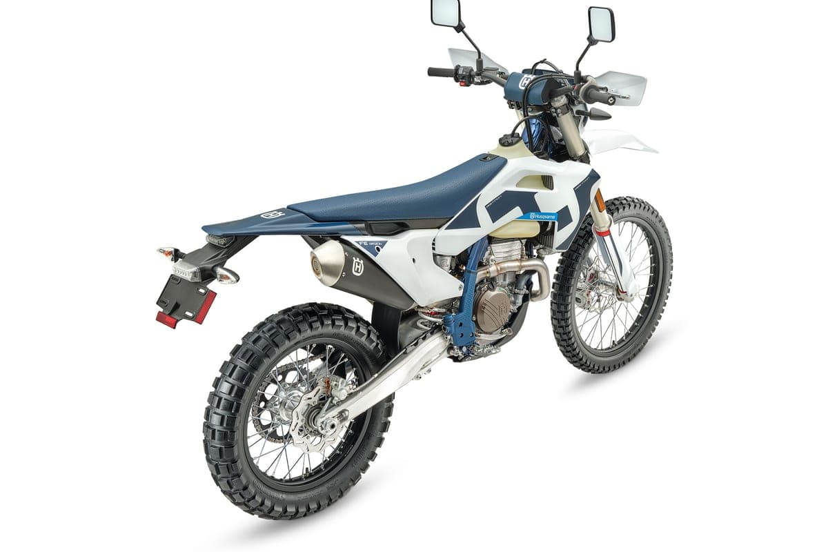 Husqvarna FE 350s rear three-quarter studio view showing the seat, taillight bracket and rear disc brake with chain guide