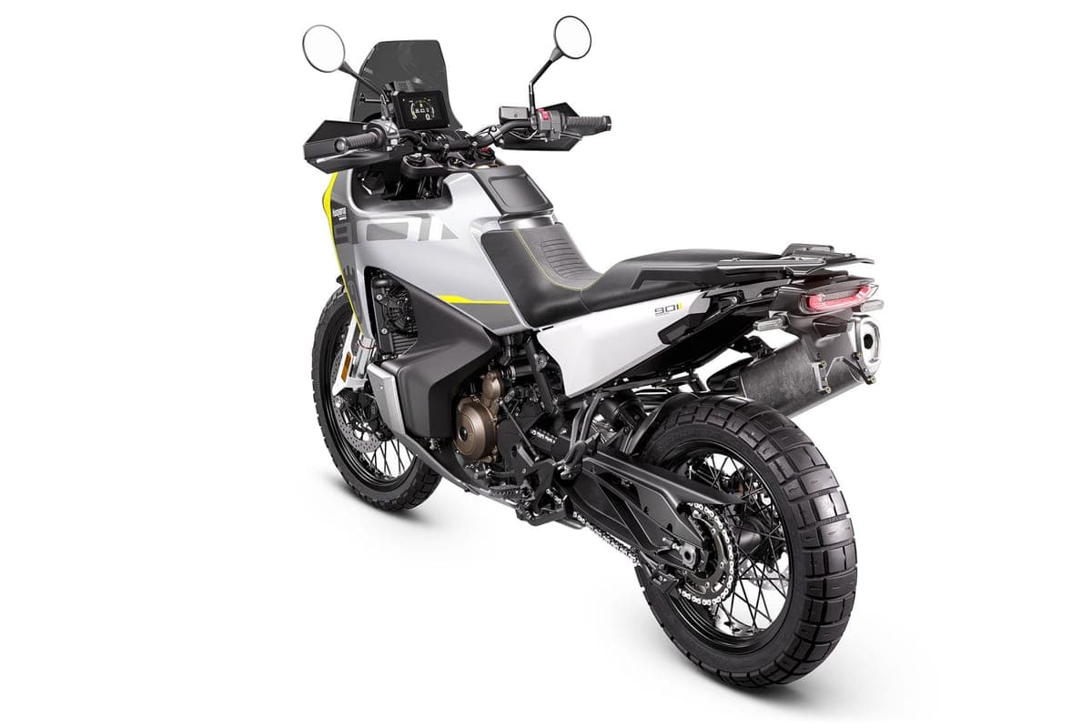Husqvarna Norden 901 rear three-quarter studio shot from above showing the seat, taillight, chain-driven swingarm and rear disc brake