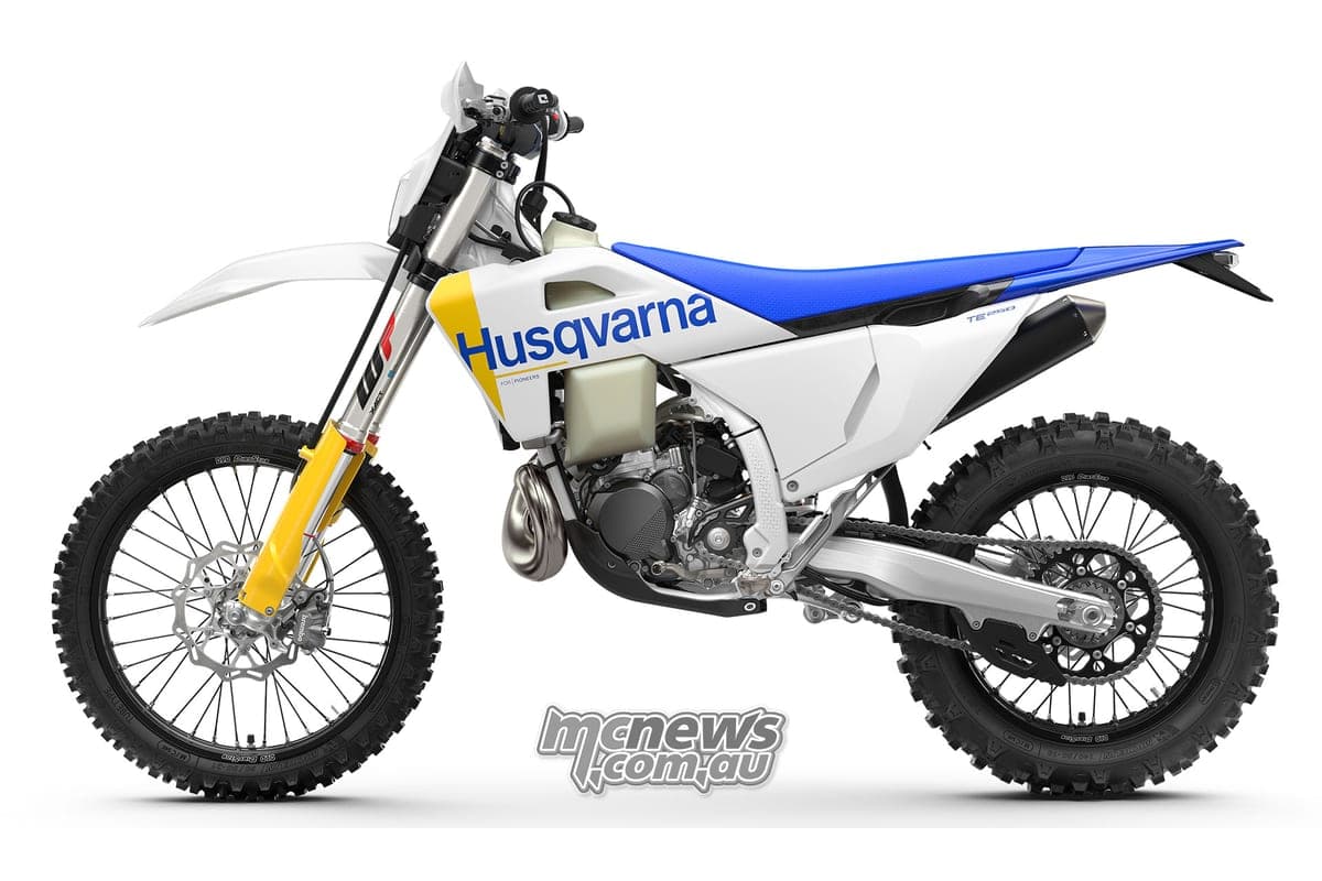 2027 Husqvarna TE 250, left-side studio profile highlighting the blue seat, WP shock linkage and spoked wheels with knobby tires