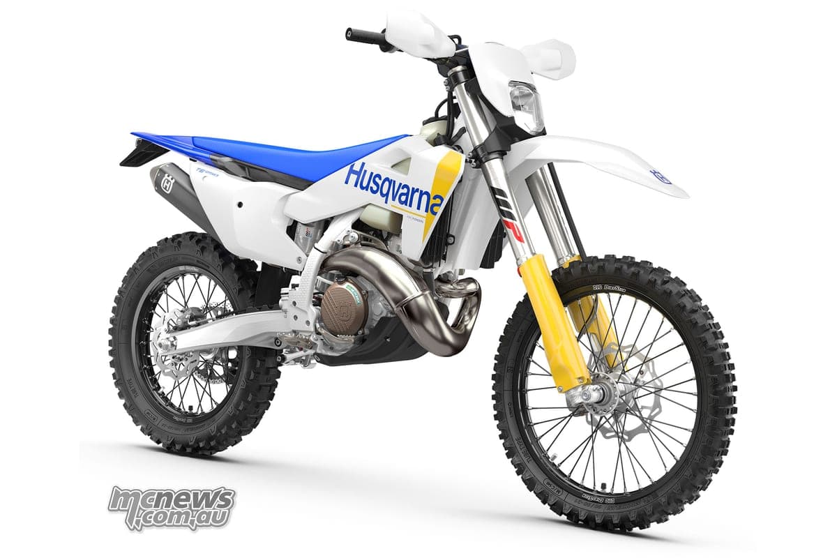 Husqvarna TE 250 front three-quarter studio view showing the headlight, yellow fork tubes and stainless header pipe