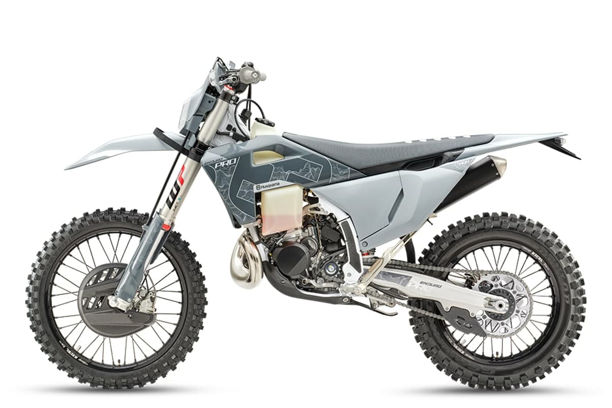 Husqvarna TE 300 Pro left-side studio profile showing the chain, linkage shock and silencer