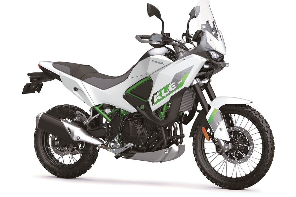 Kawasaki KLE500 ABS in white and green, front three-quarter studio view highlighting the beak fender, twin headlights and knobby dual-sport tires