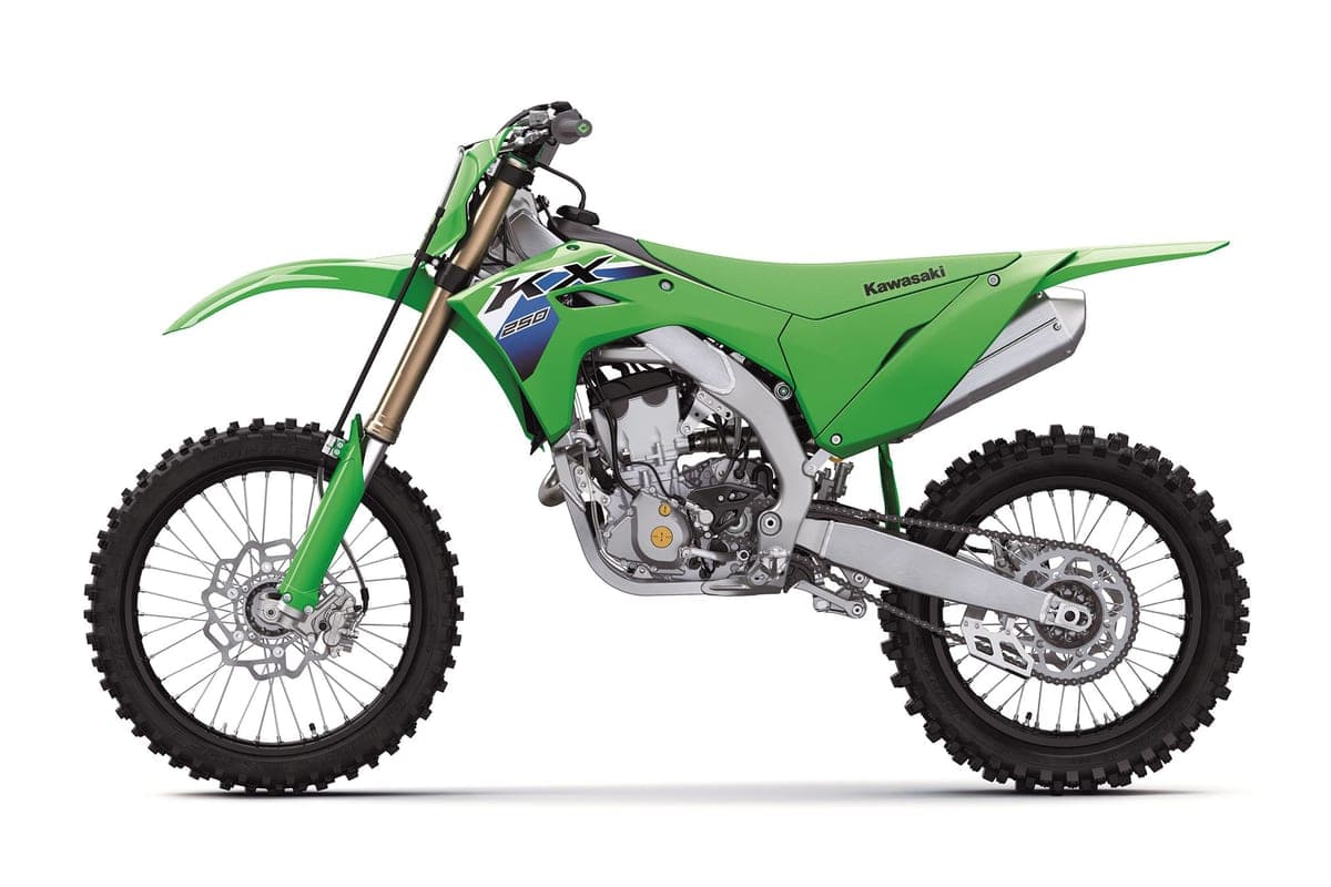 Kawasaki KX250F left-side studio profile highlighting the blue and white shroud graphics, spoked wheels and braided front brake line