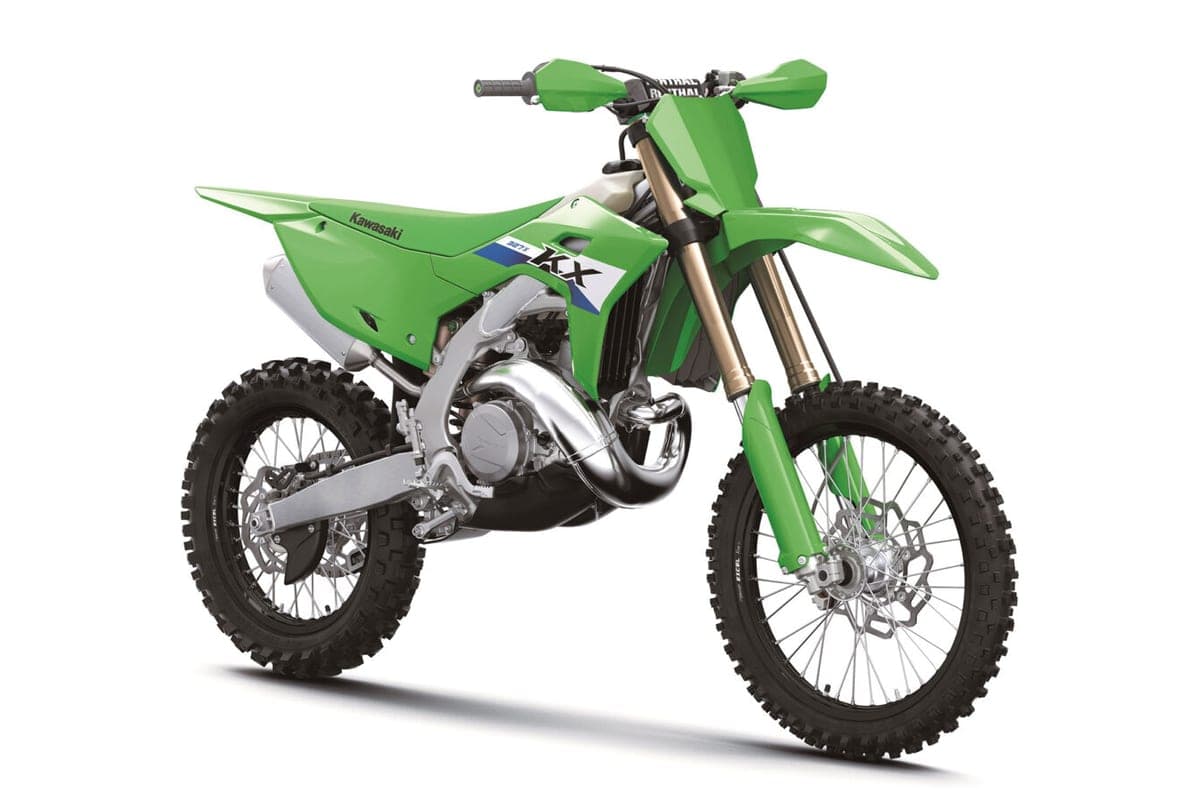 Kawasaki KX327X front three-quarter studio view showing the gold coated forks, KX graphics panel and radiator-mounted number plate area