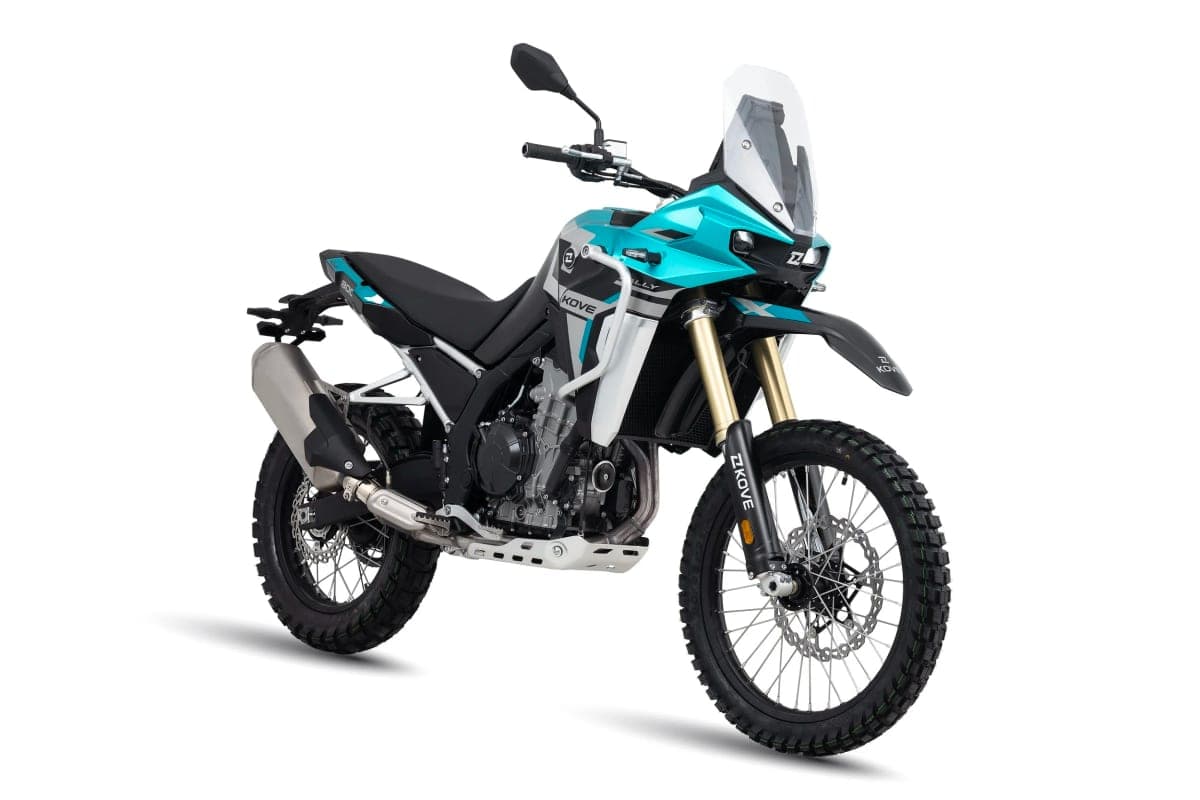 Kove 800X Rally in teal and black, front three-quarter studio view showing the gold-finish inverted forks, tall windscreen and rally-style headlight fairing
