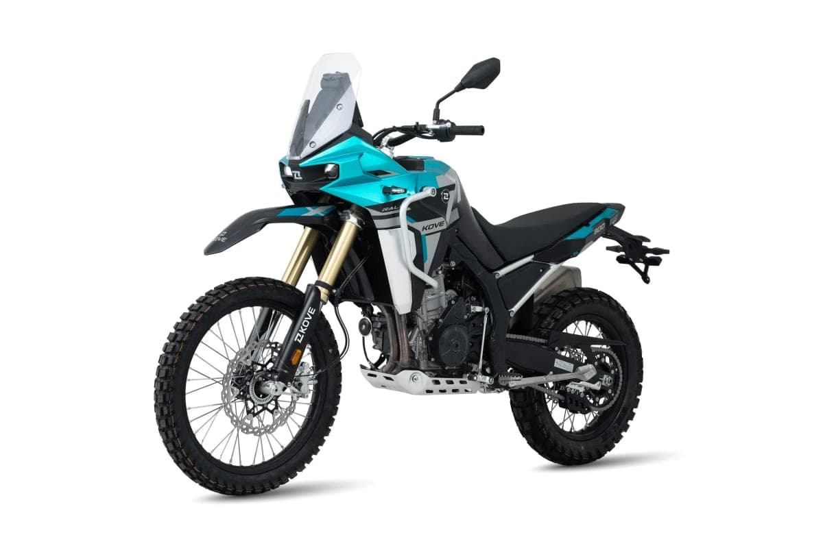 Kove 800X Rally rear three-quarter studio shot highlighting the twin exhaust muffler, spoked rear wheel, chain drive and aluminum bash plate