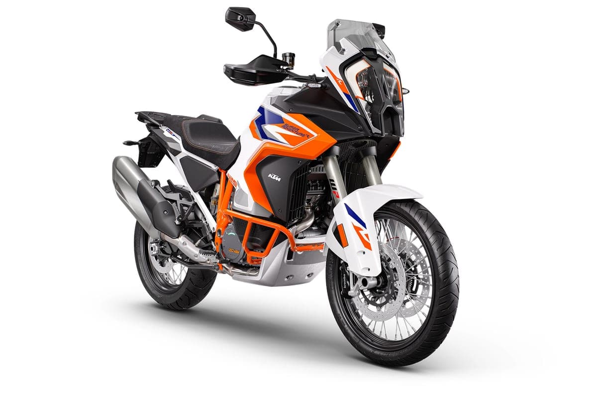 KTM 1390 Super Adventure R front three-quarter studio view highlighting the LED headlight cluster, orange upside-down forks and Brembo front brake
