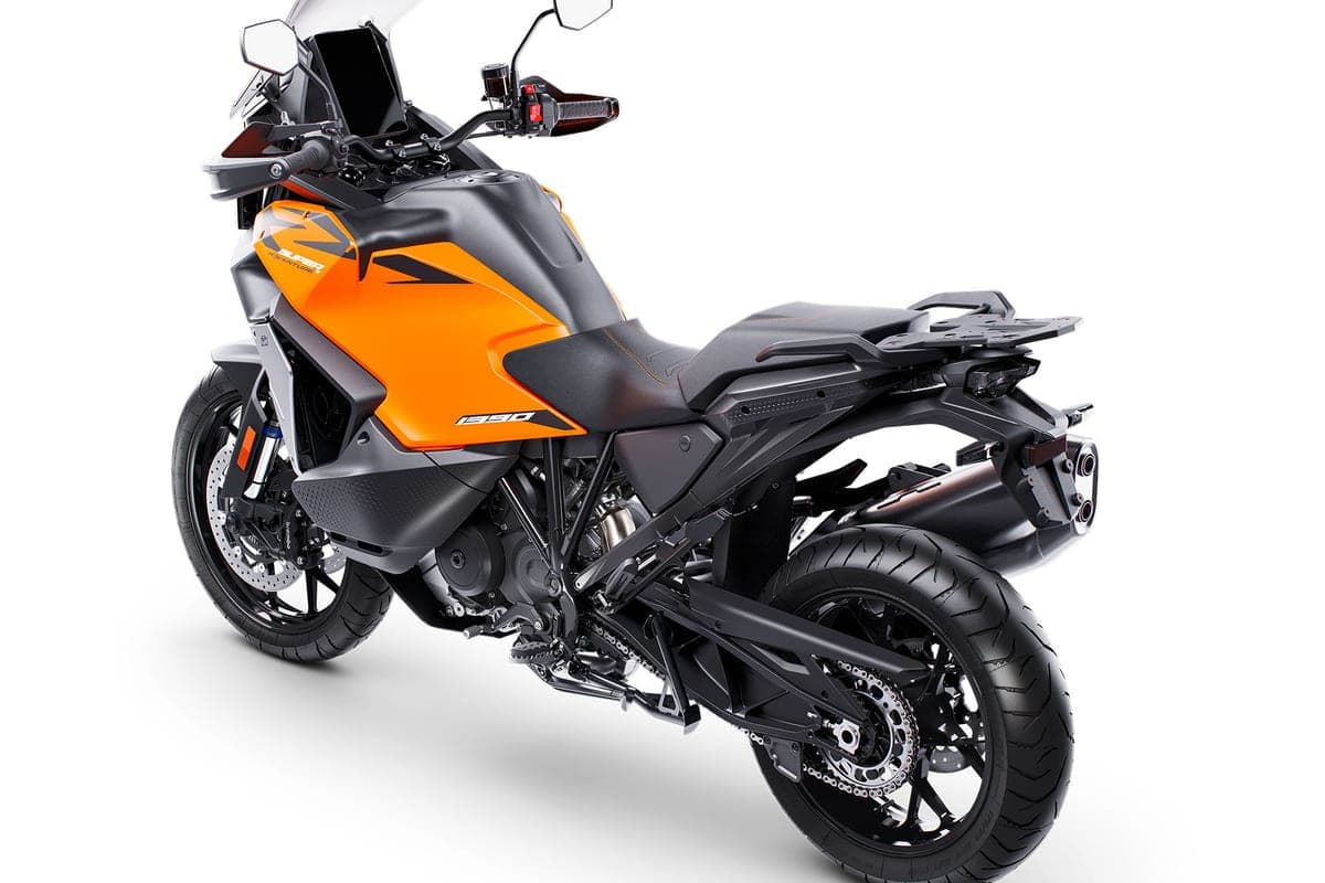 KTM 1390 Super Adventure S EVO rear three-quarter studio view highlighting the trellis subframe, twin exhaust tips and adjustable rear rack