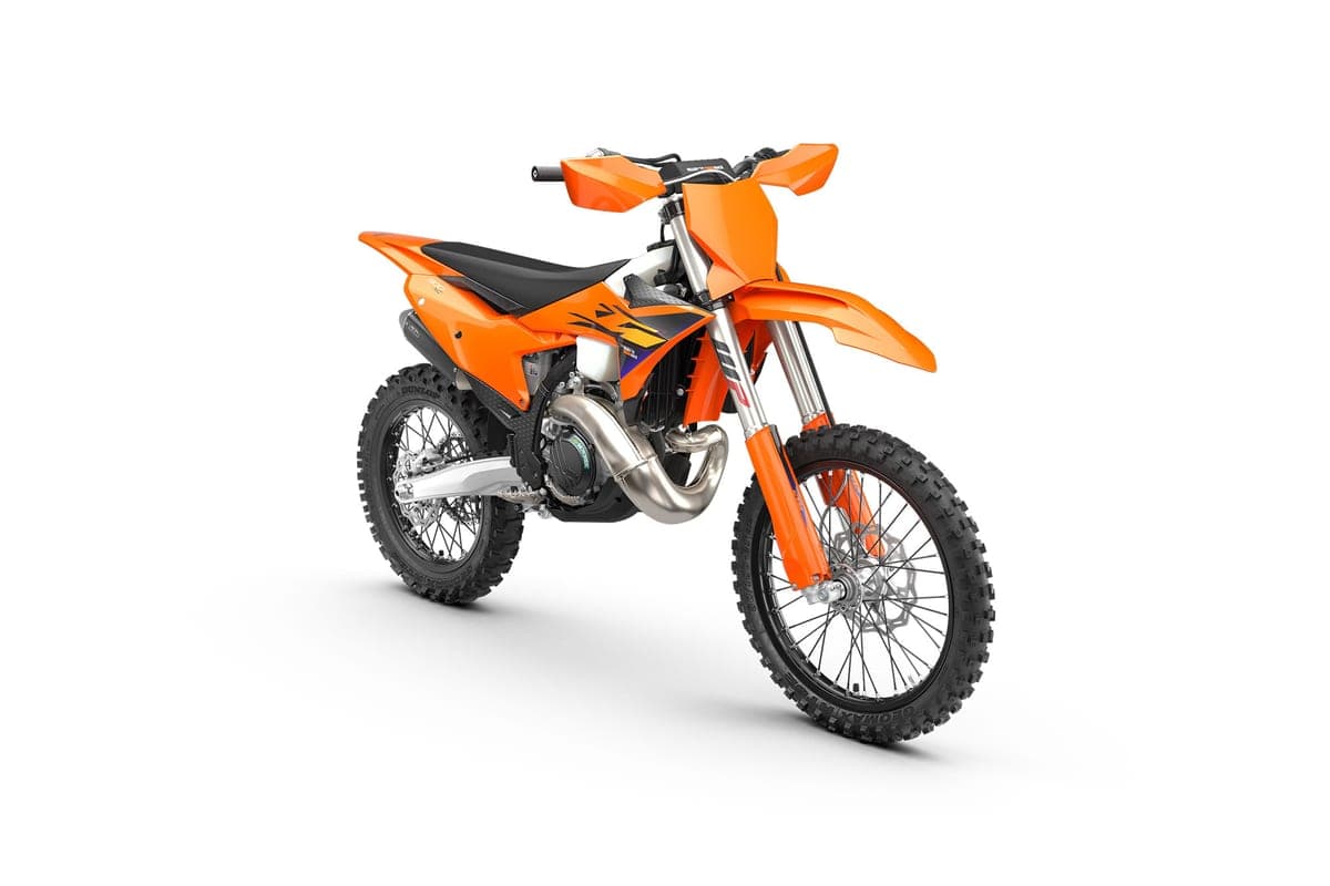 2027 KTM 300 XC front three-quarter studio view showing the WP inverted forks, spoked front wheel and Dunlop knobby tire