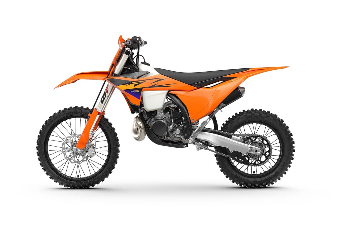 KTM 300 XC left-side studio profile highlighting the expansion chamber exhaust, disc brakes and black seat