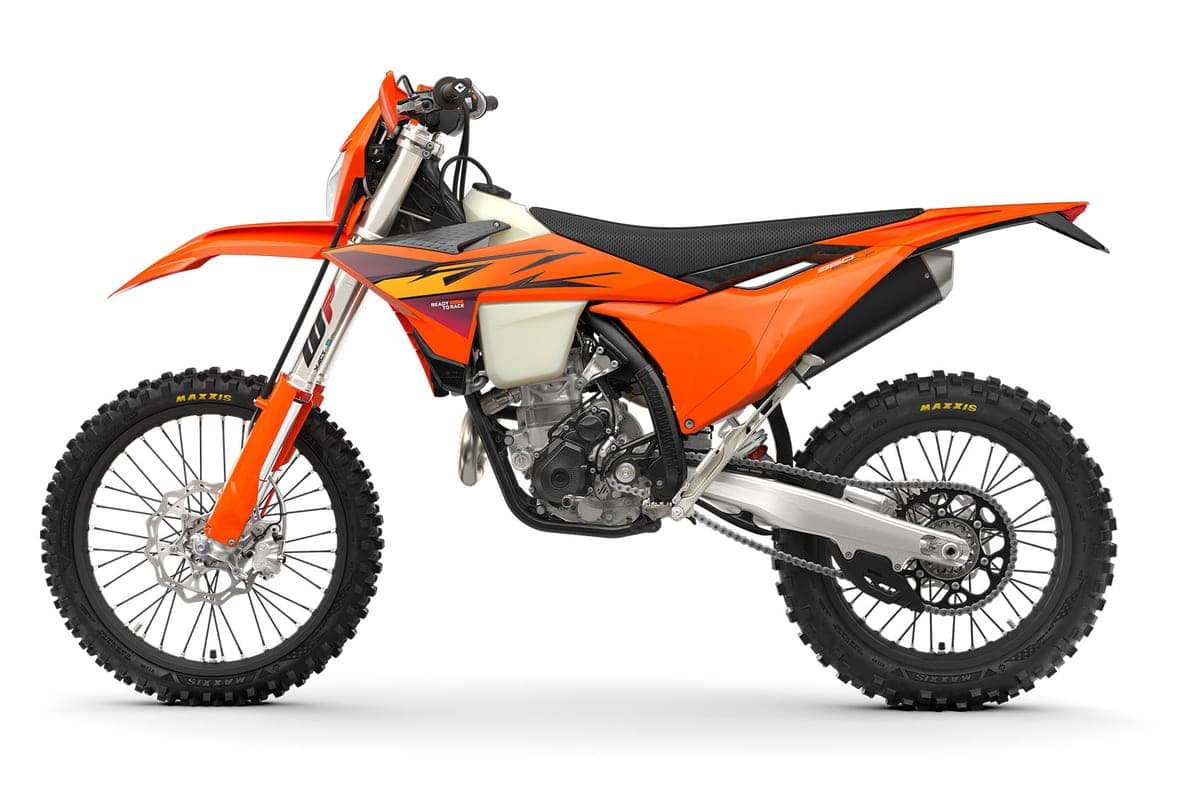 KTM 350 EXC-F left-side studio view highlighting the black seat, chain-driven rear wheel and translucent fuel tank under the seat