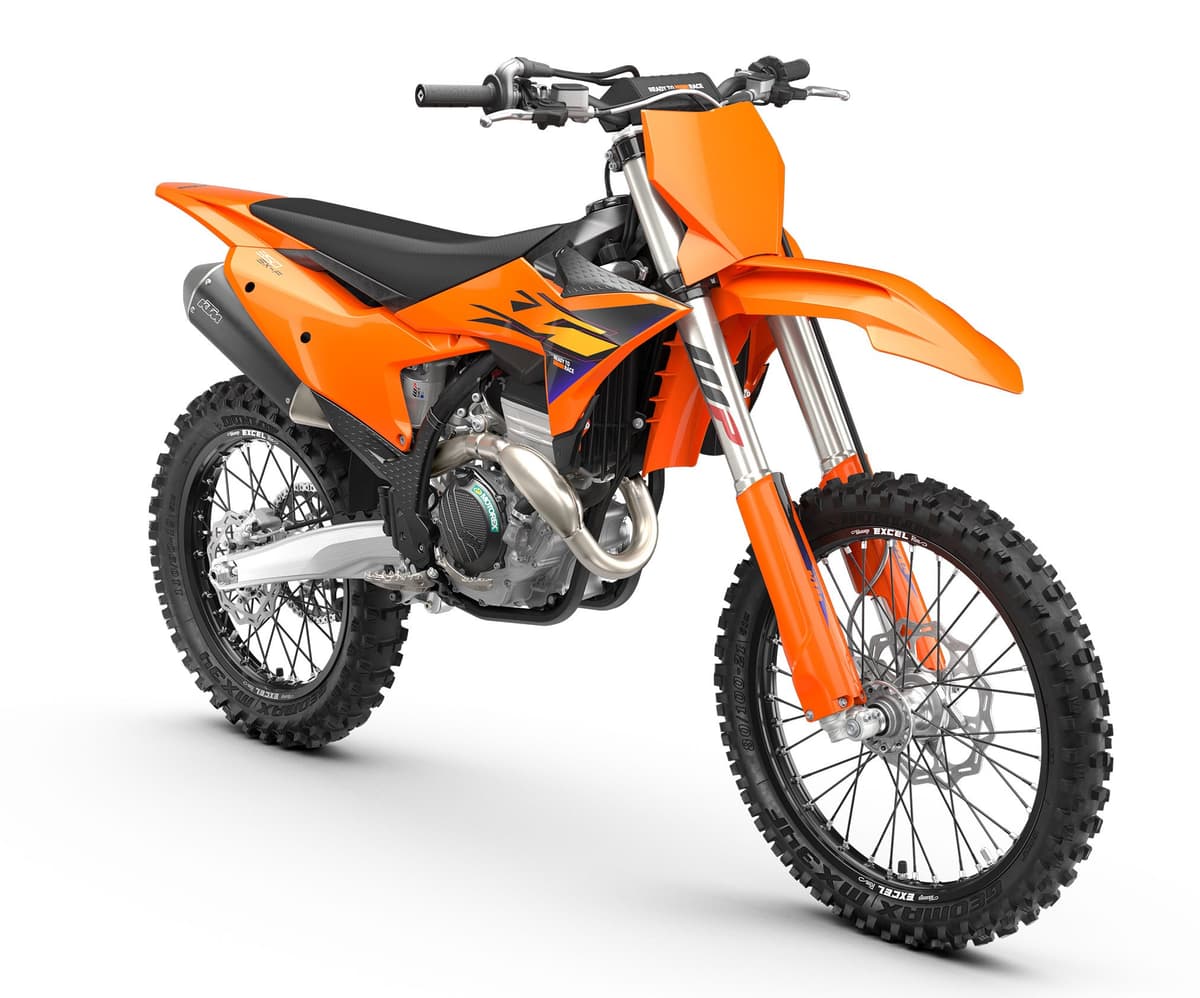 2027 KTM 350 SX-F front three-quarter studio view highlighting the orange number plate, exposed exhaust headers and Dunlop knobby front tire