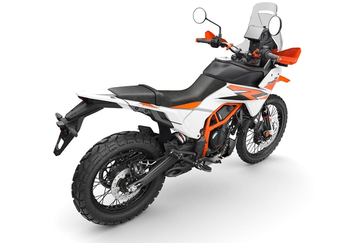 390 Adventure R rear three-quarter studio shot showing the tucked exhaust, rear disc brake and upswept tail with grab rails