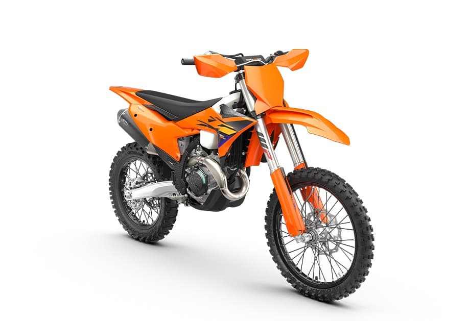 KTM 450 XC-F front three-quarter studio view highlighting the orange bodywork graphics, radiator shrouds and muffler