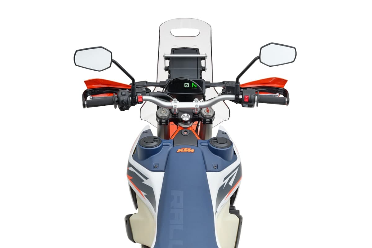 KTM 690 Rally cockpit seen head-on, showing the 4.2-inch TFT display, integrated windscreen, handguards and the twin front fuel tanks
