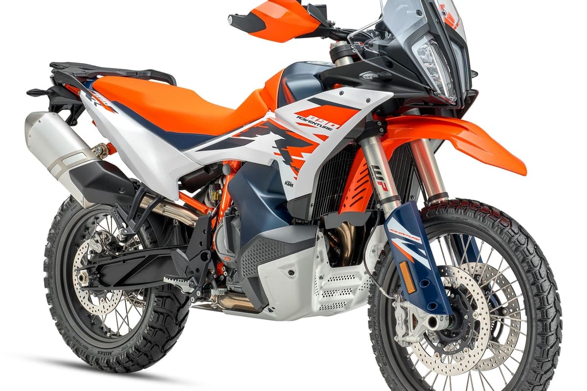 KTM 890 Adventure R front three-quarter studio view highlighting the split headlight, WP fork guards and aluminum skid plate