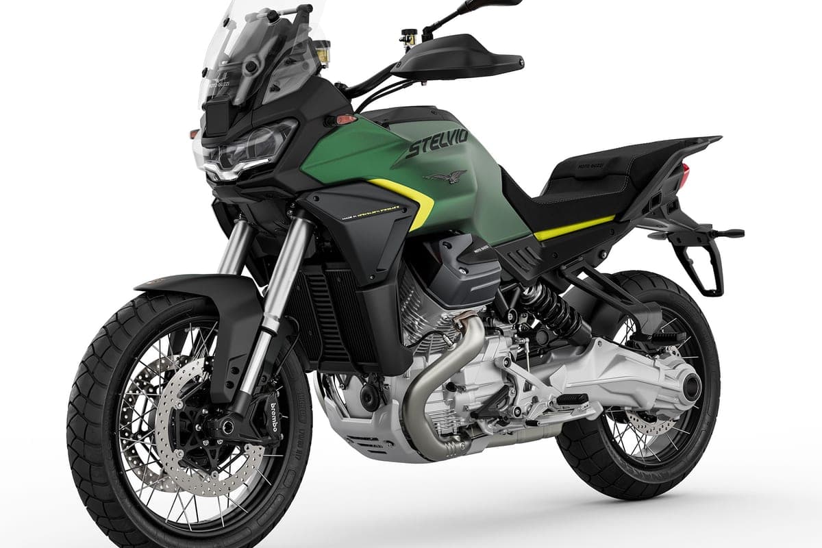 Moto Guzzi Stelvio in green, front three-quarter studio view highlighting the LED headlight, inverted forks and Brembo front brake calipers