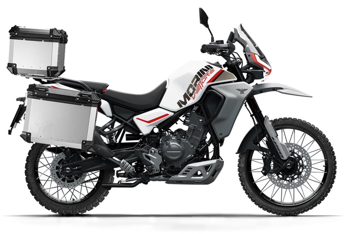 Moto Morini Vettore 450 in white livery fitted with silver aluminum panniers and top case, right-side studio profile with wire-spoke wheels