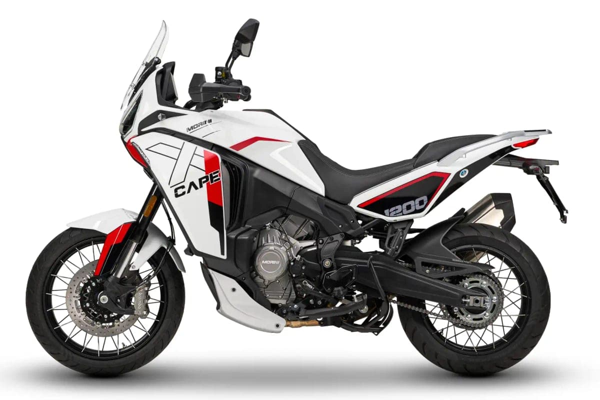 Moto Morini X-Cape 1200 in white and red, right-side studio profile highlighting the tall windscreen, chain drive and stubby exhaust can