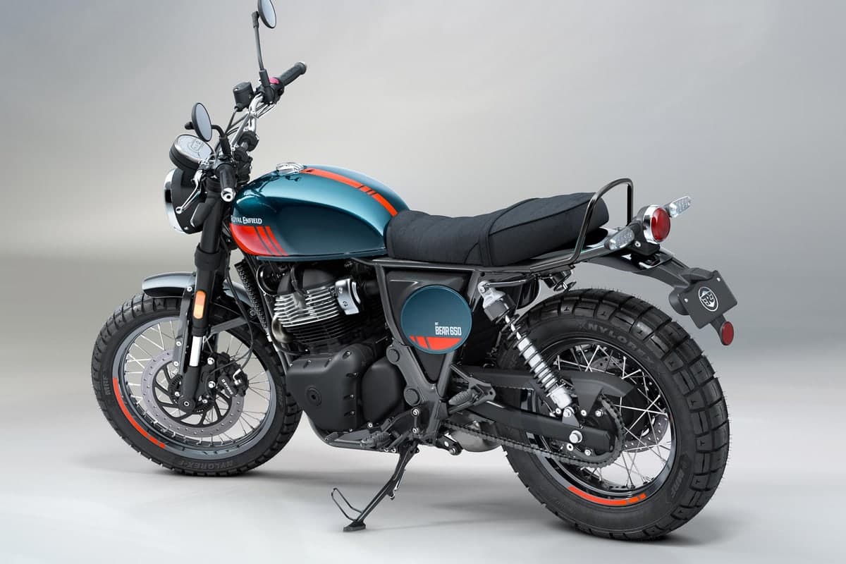 Royal Enfield Bear 650 in petrol green, rear three-quarter studio view showing the 2-into-1 exhaust, grab rail and round tail light