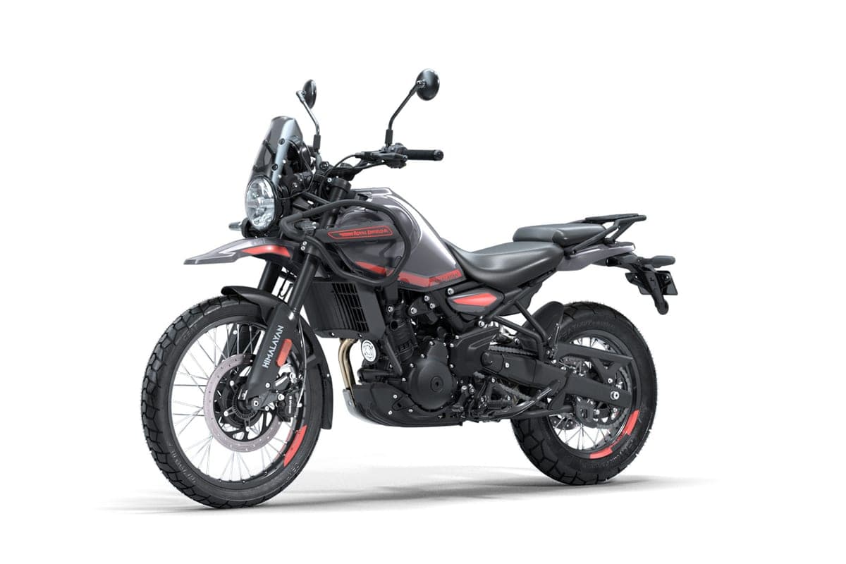 Royal Enfield Himalayan 450 in gunmetal grey with red accents, front three-quarter studio view highlighting the round headlight and inverted forks