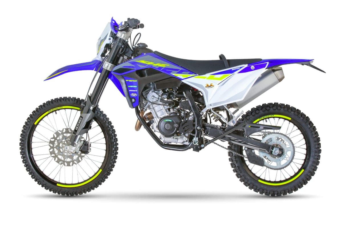 Sherco 125 4T SE-RS Factory right-side studio profile with the SHERCO graphics panel, chain guide and open cradle frame in view